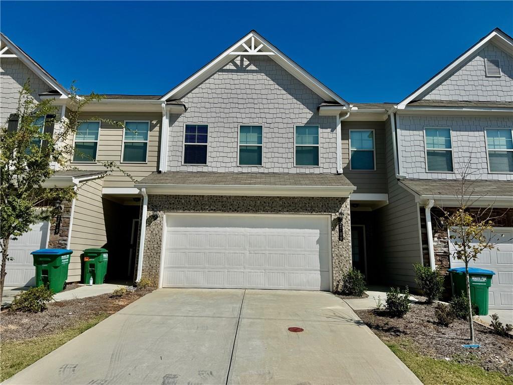 a front view of a house with yard