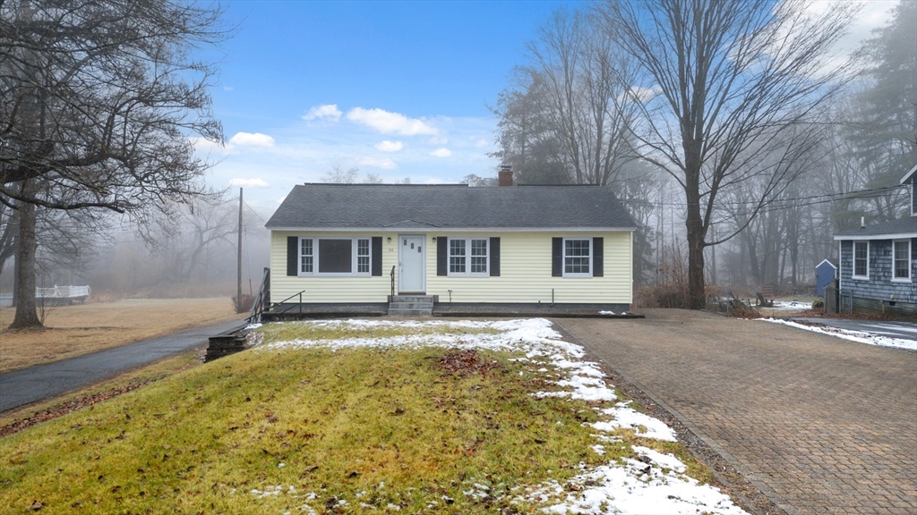 front view of a house with a yard