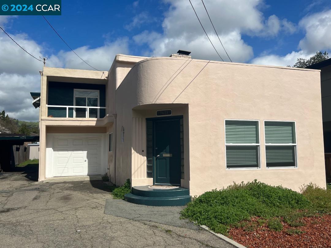 a front view of a house with a garage