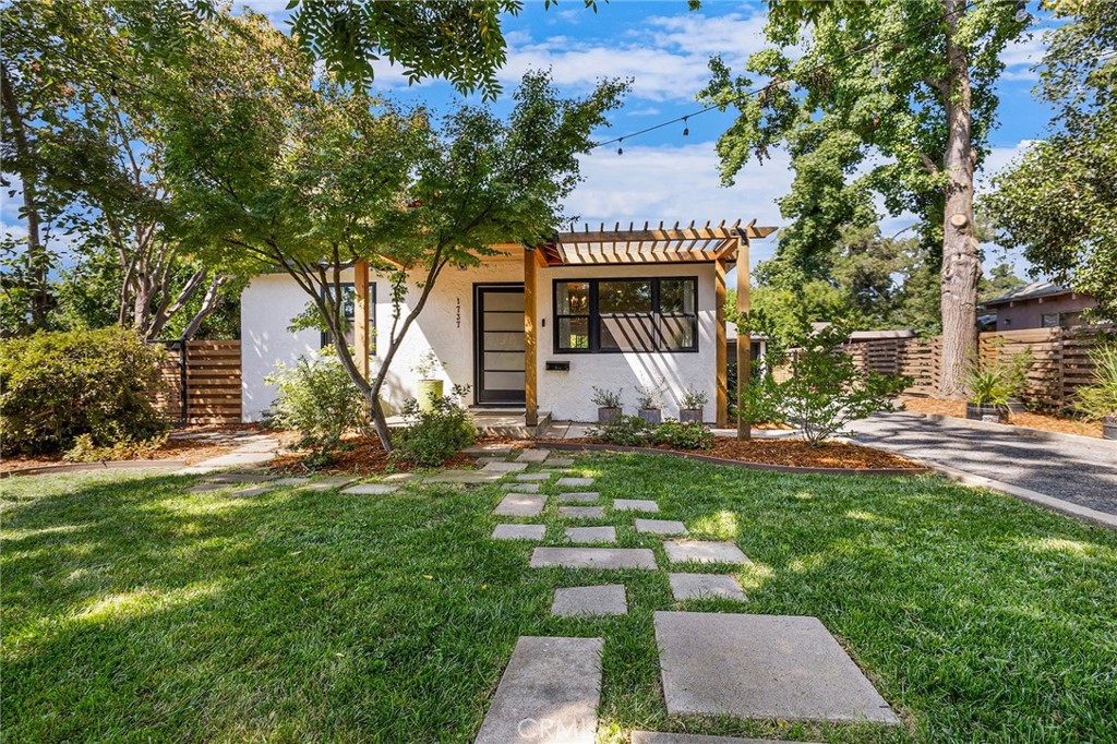 a front view of a house with garden