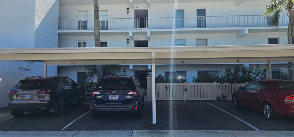 a front view of a house with parking space