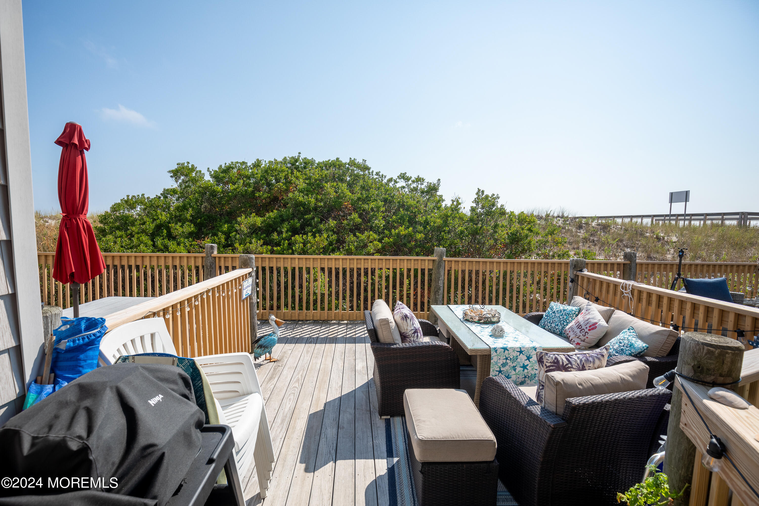 a view of a roof deck with couches