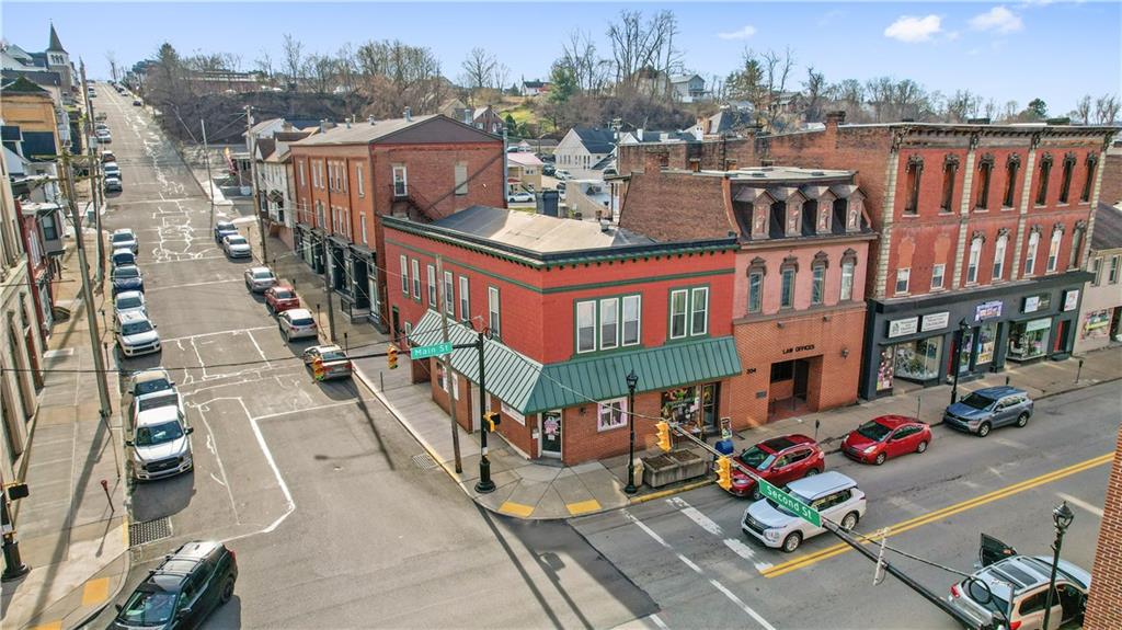 an aerial view of a brick building with many windows