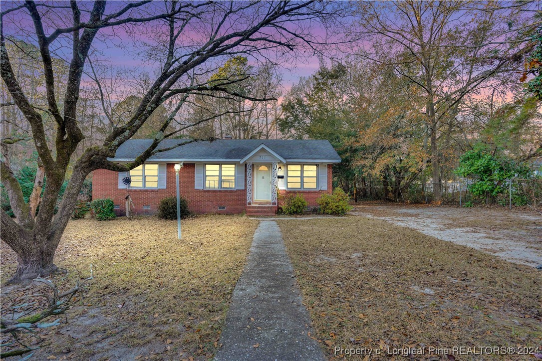 a house with trees in front of it