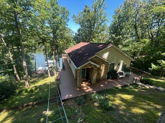 a aerial view of a house with a yard table and chairs