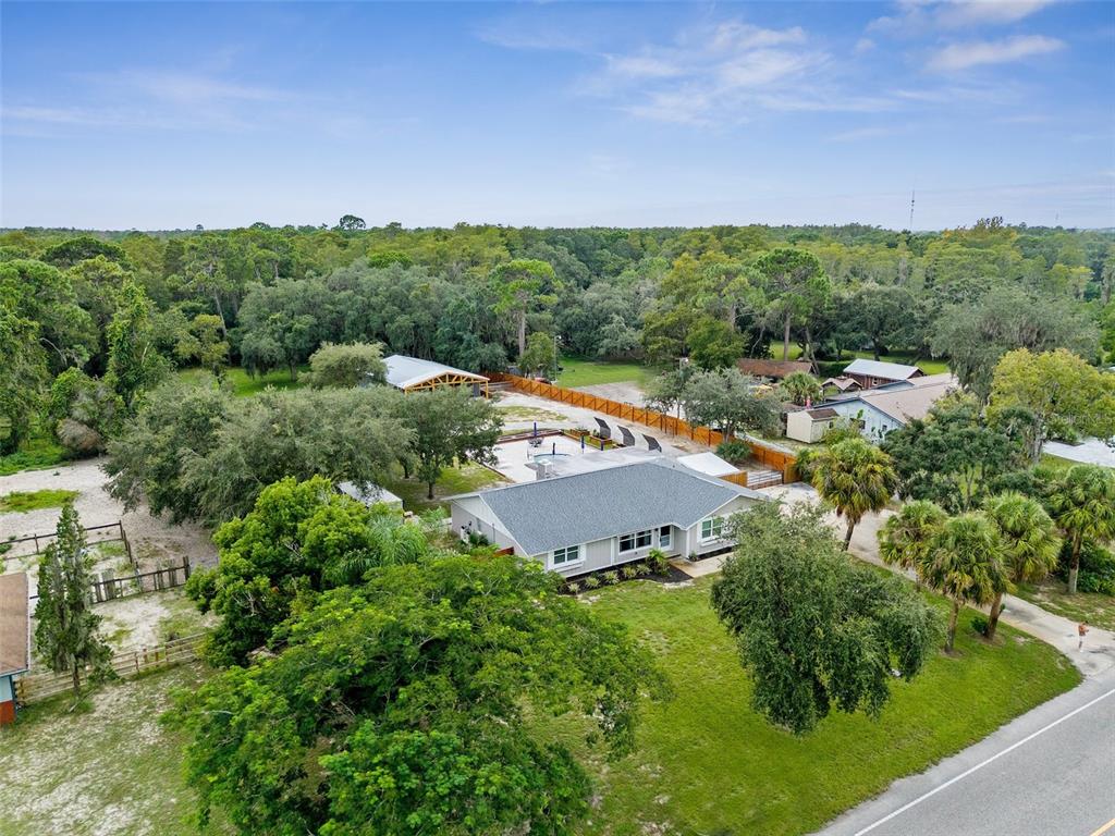 an aerial view of a house with mountain view