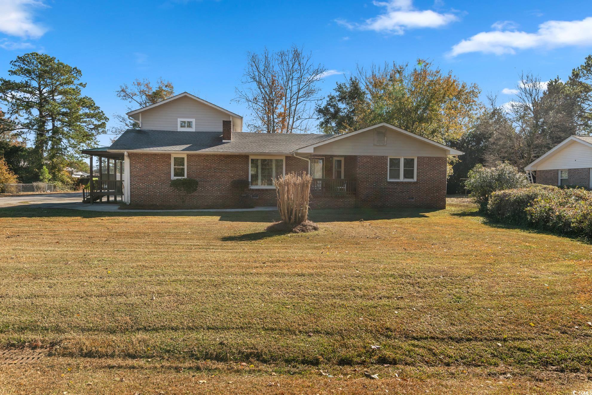 Front of house with a lawn