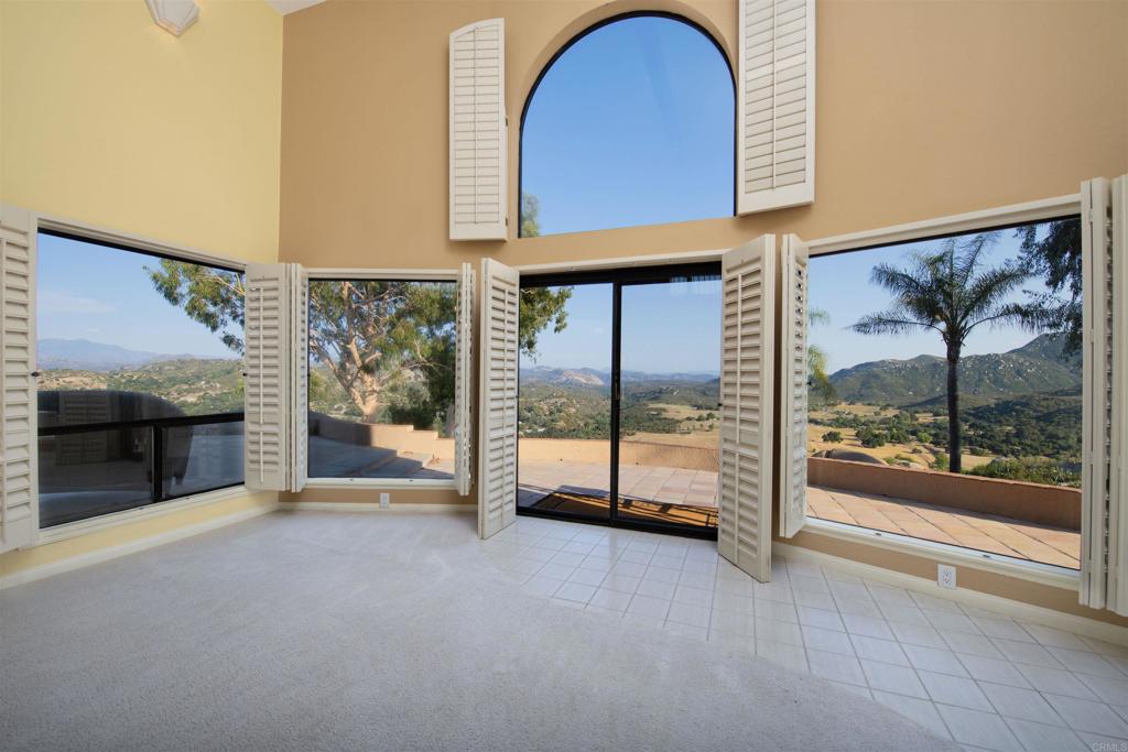 a view of an empty room with sliding glass door