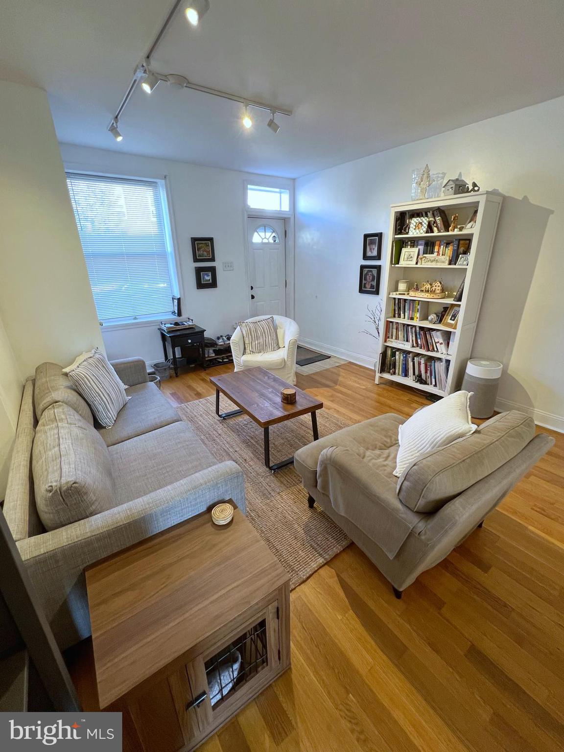 a bedroom with furniture and wooden floor