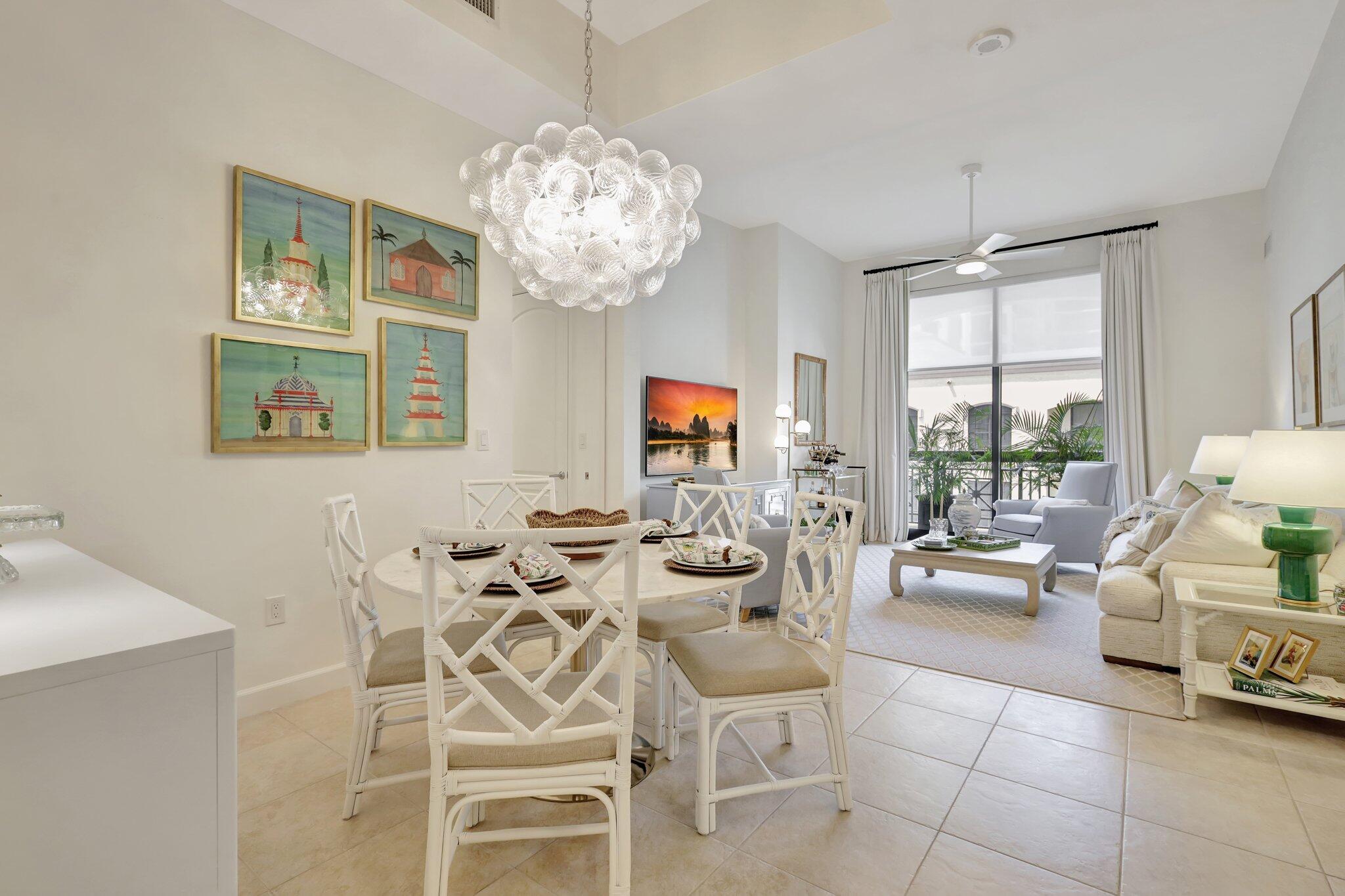 a view of a dining room with furniture wooden floor and chandelier