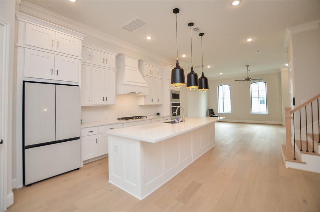 Kitchen showing Modern Look and Feel of Cabinets and fittings. You can also see how the Fridge complements the look.