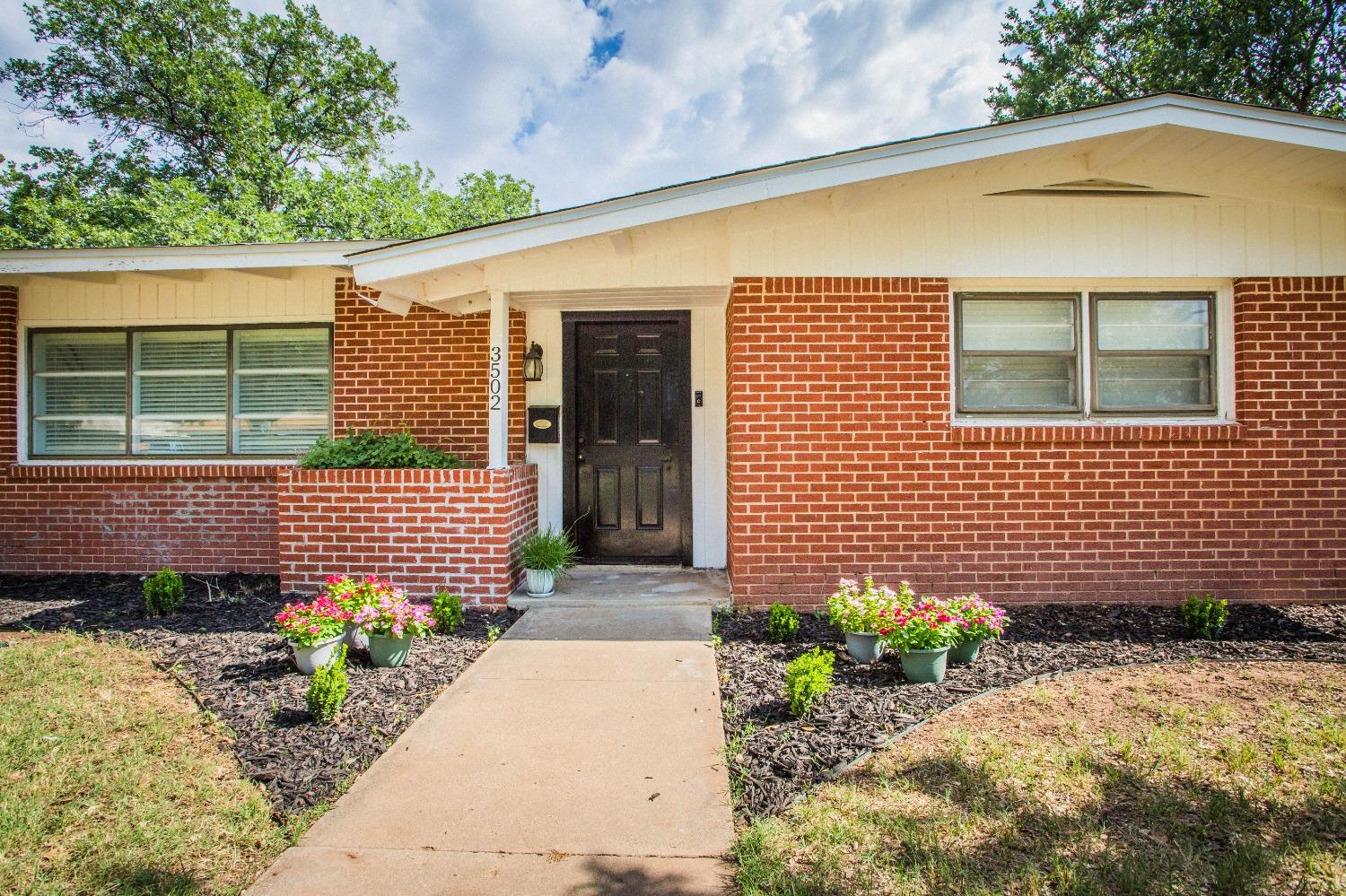 a front view of a house having yard