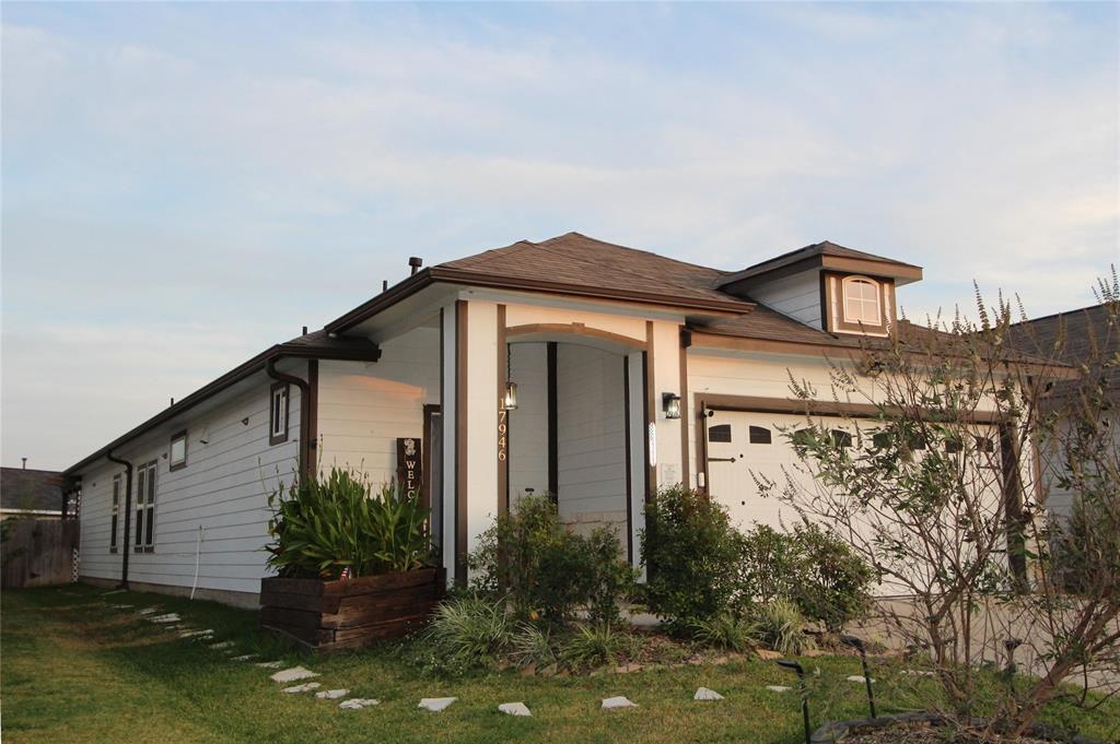 Welcome to this charming home with excellent curb appeal. The front of the home features thoughtfully arranged plants that add warmth and vibrancy to the entryway, creating a welcoming atmosphere!