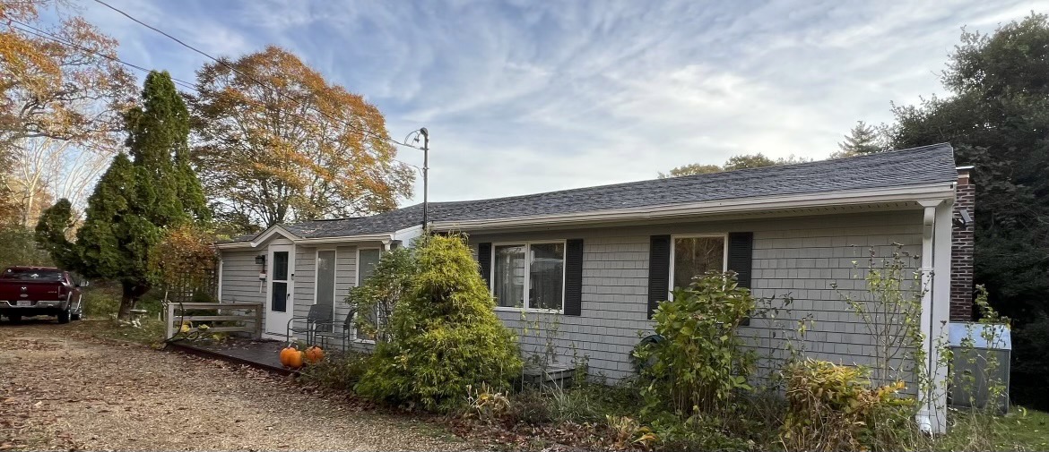 a front view of a house with garden