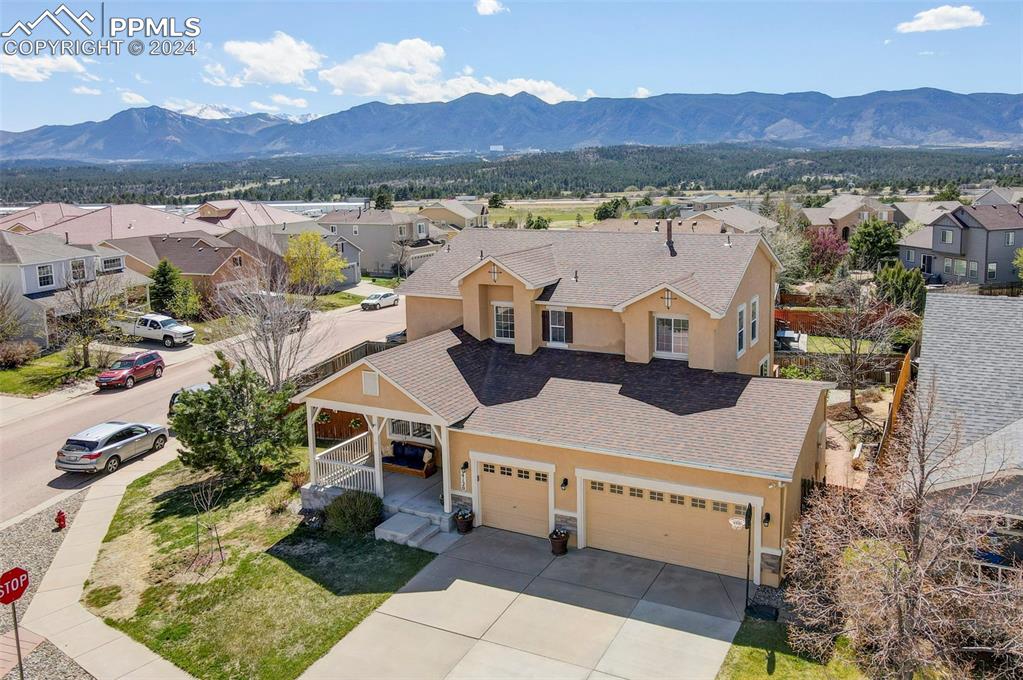 an aerial view of a house with a garden