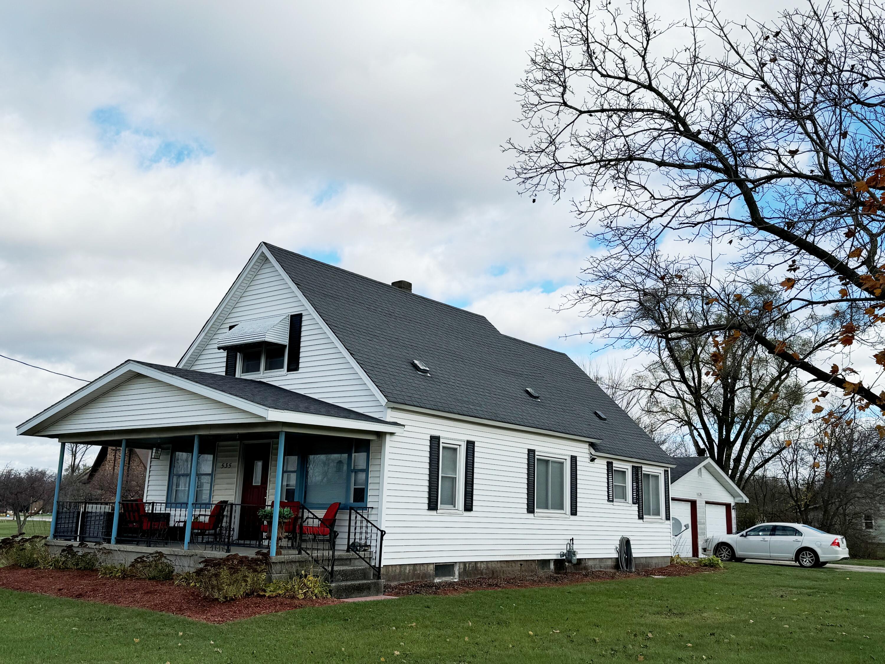 a front view of a house with garden