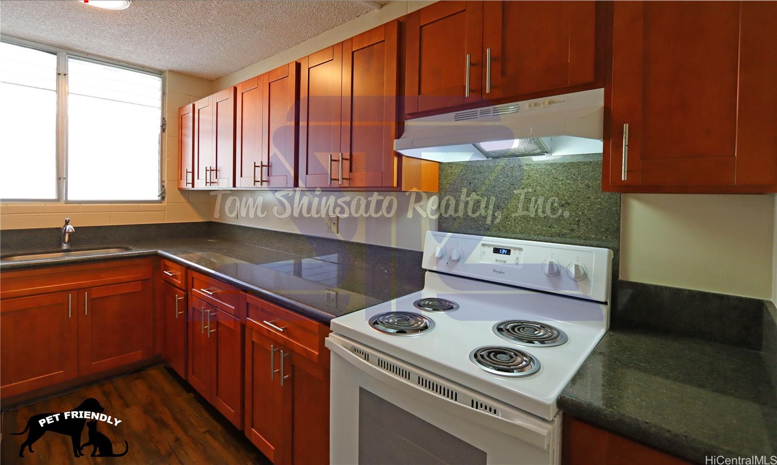 a kitchen with a stove and a sink