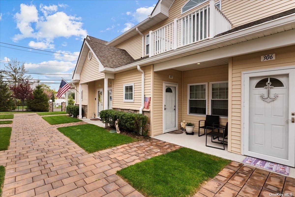 a view of a yard in front view of a house