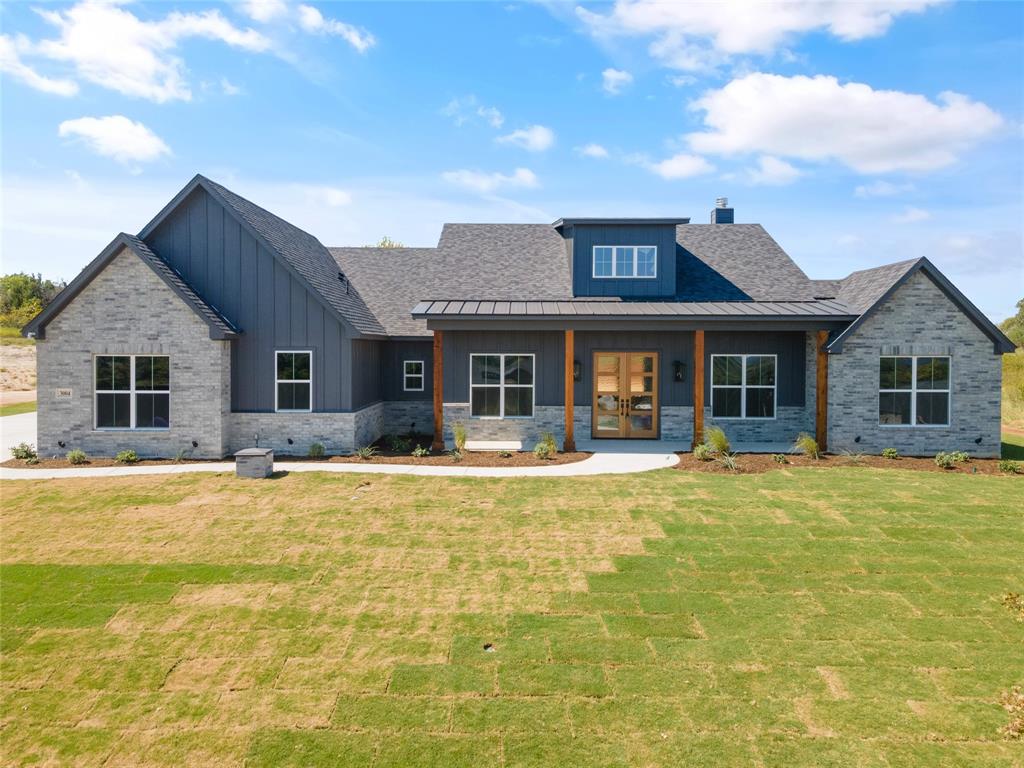 a view of a house with swimming pool and a yard