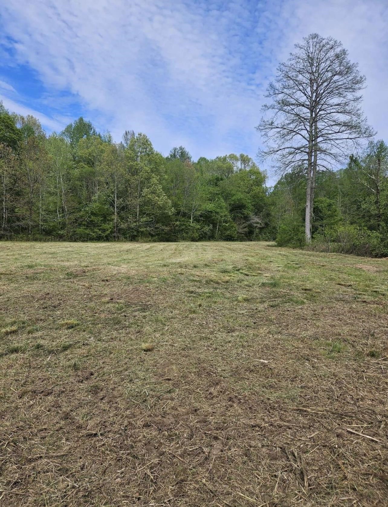 a view of a field with an outdoor space