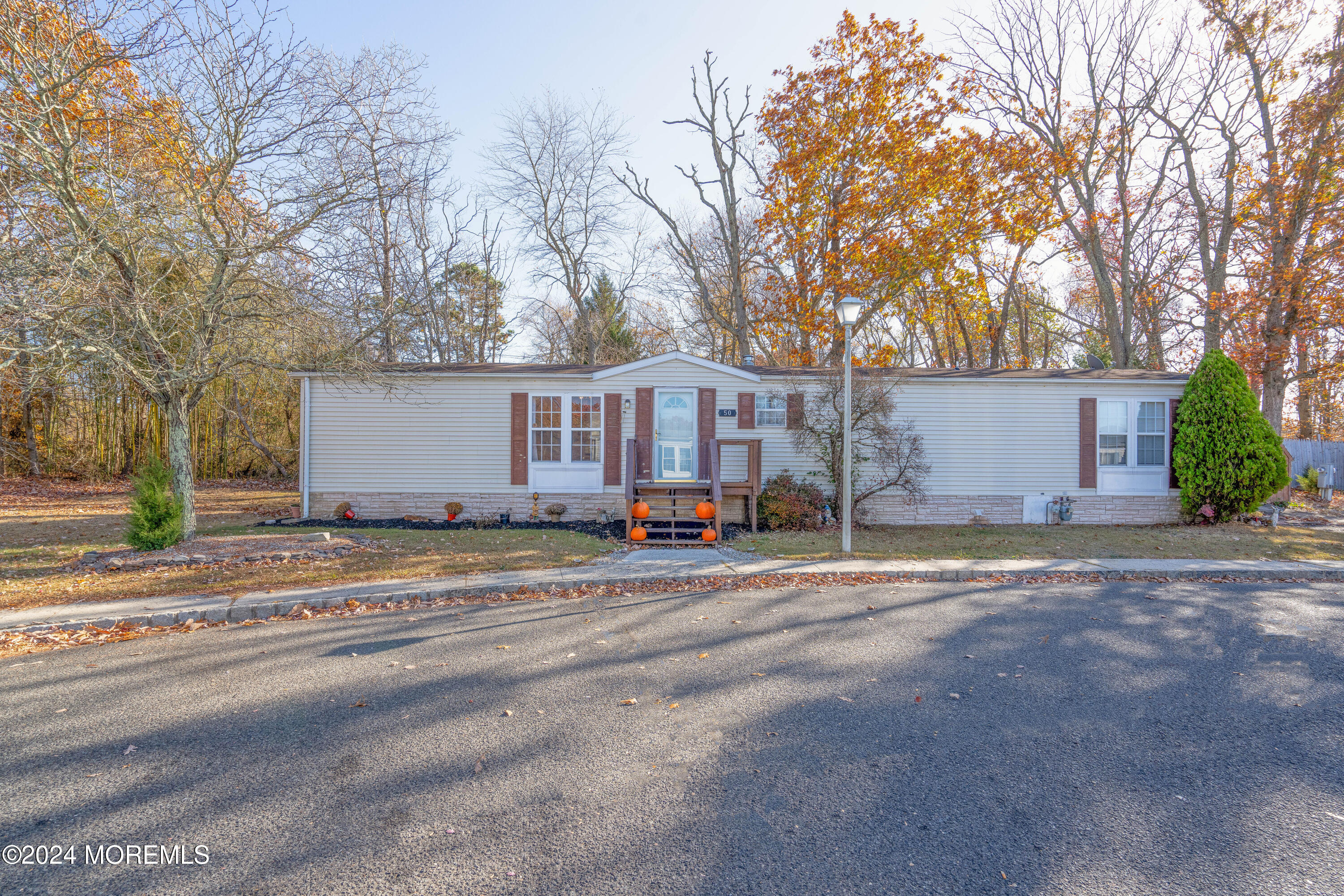 a view of a trees in front of a house