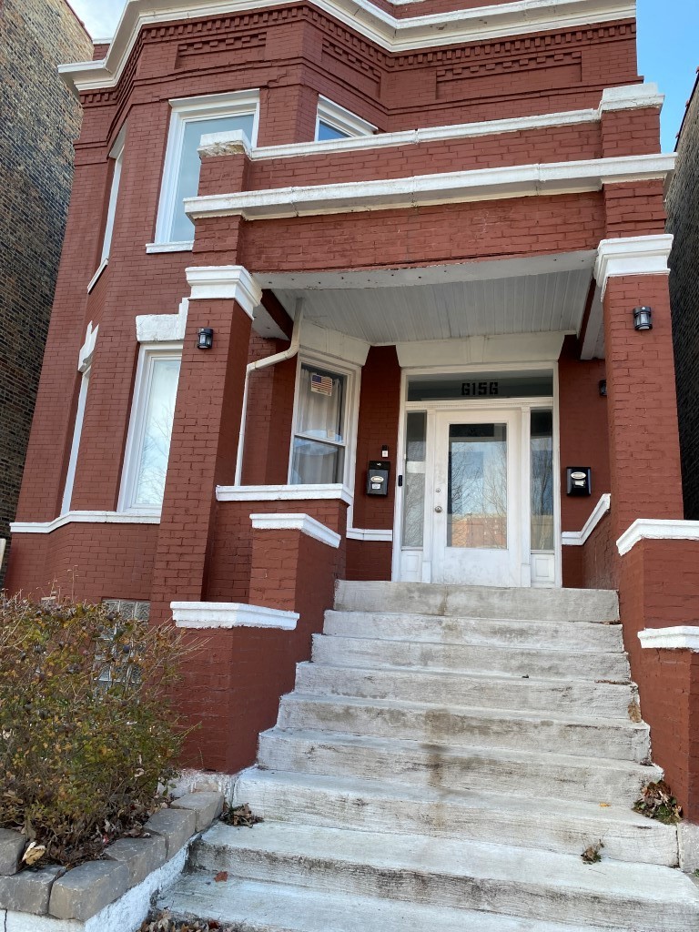 a view of a building with a street