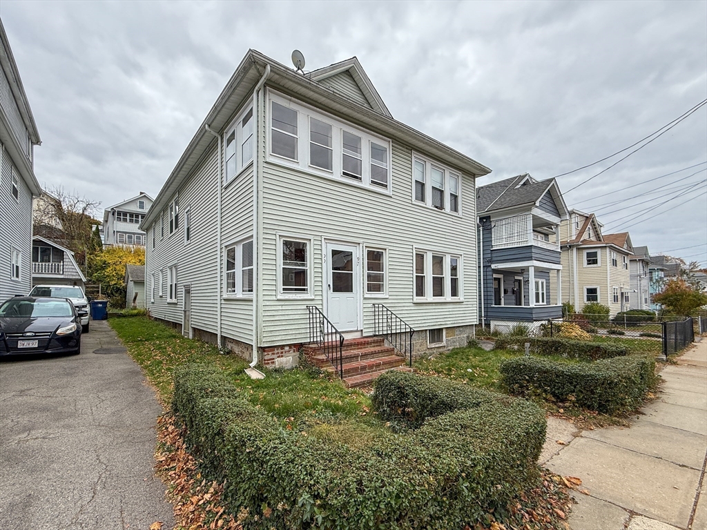 a front view of a house with a yard