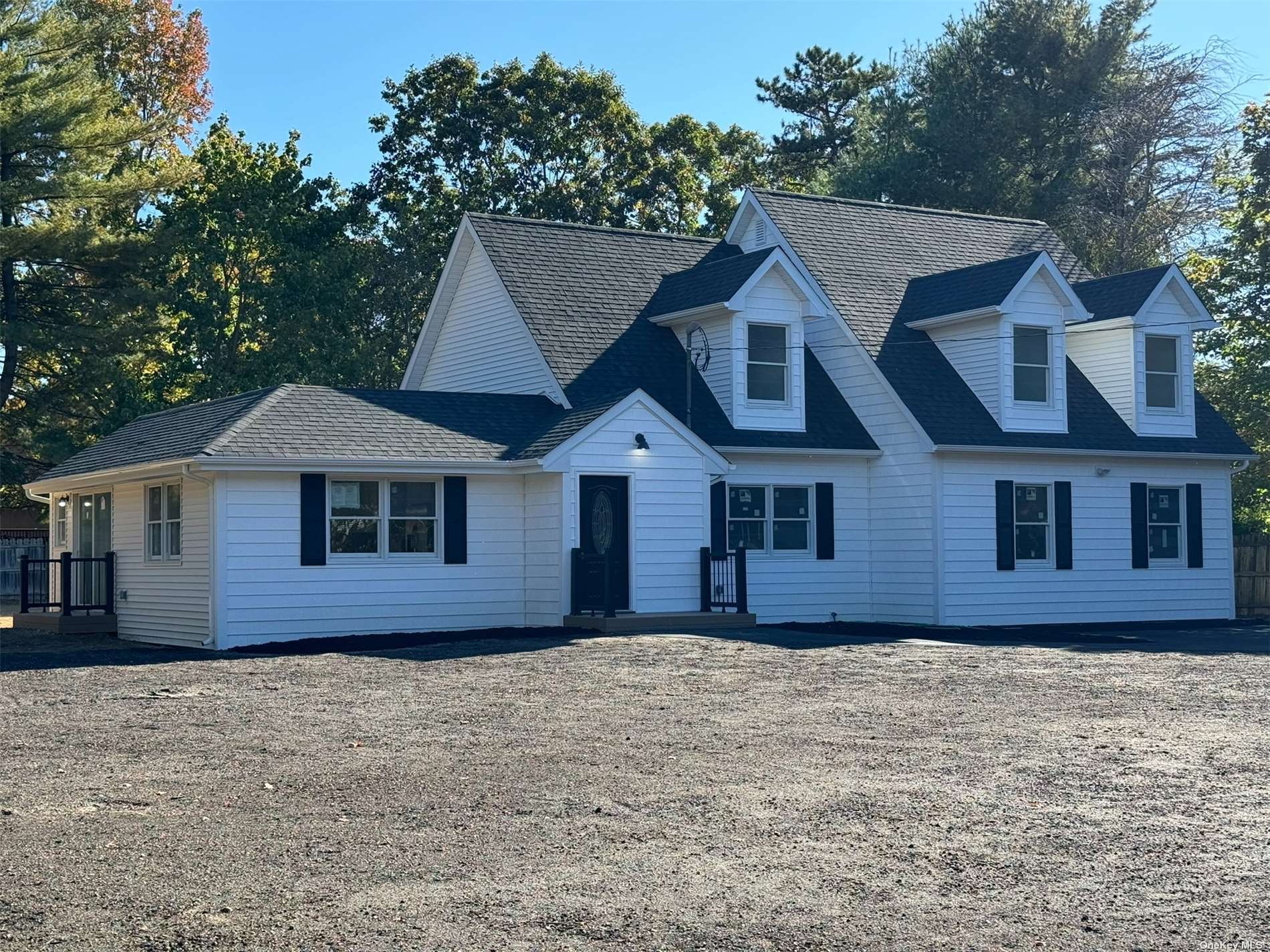 a house that has a tree in front of it