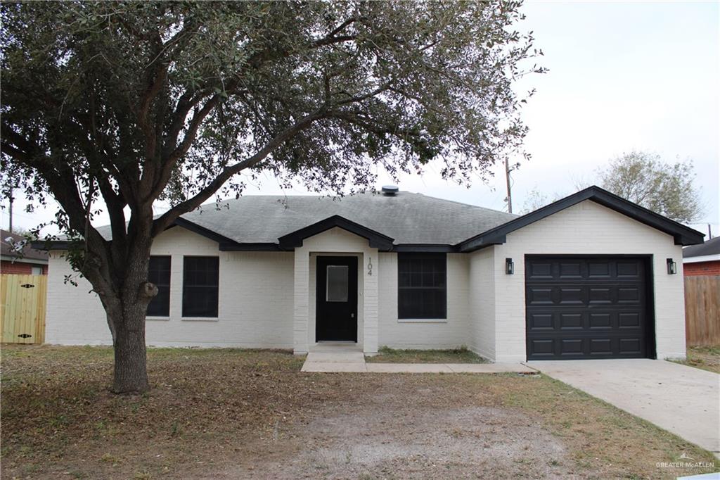 Ranch-style house featuring a garage