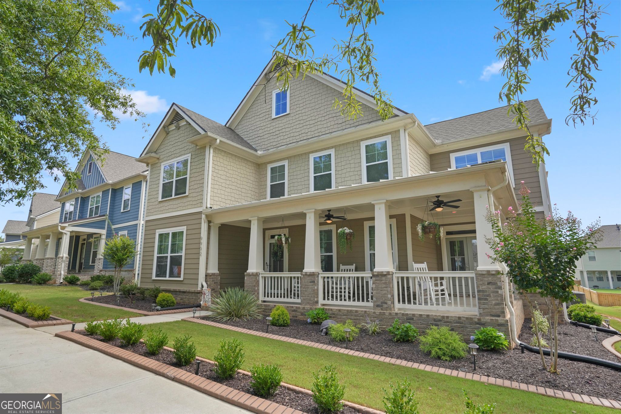 a front view of a house with garden