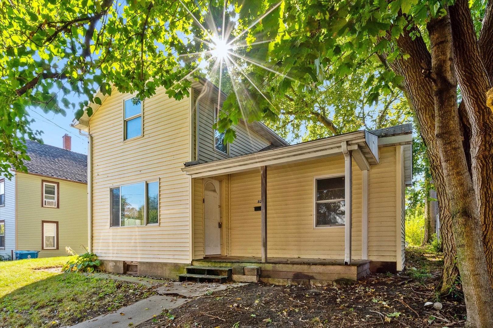 a view of a house with a tree