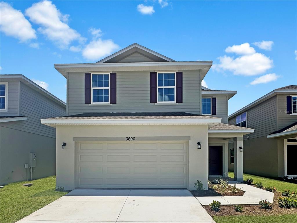 a front view of a house with yard