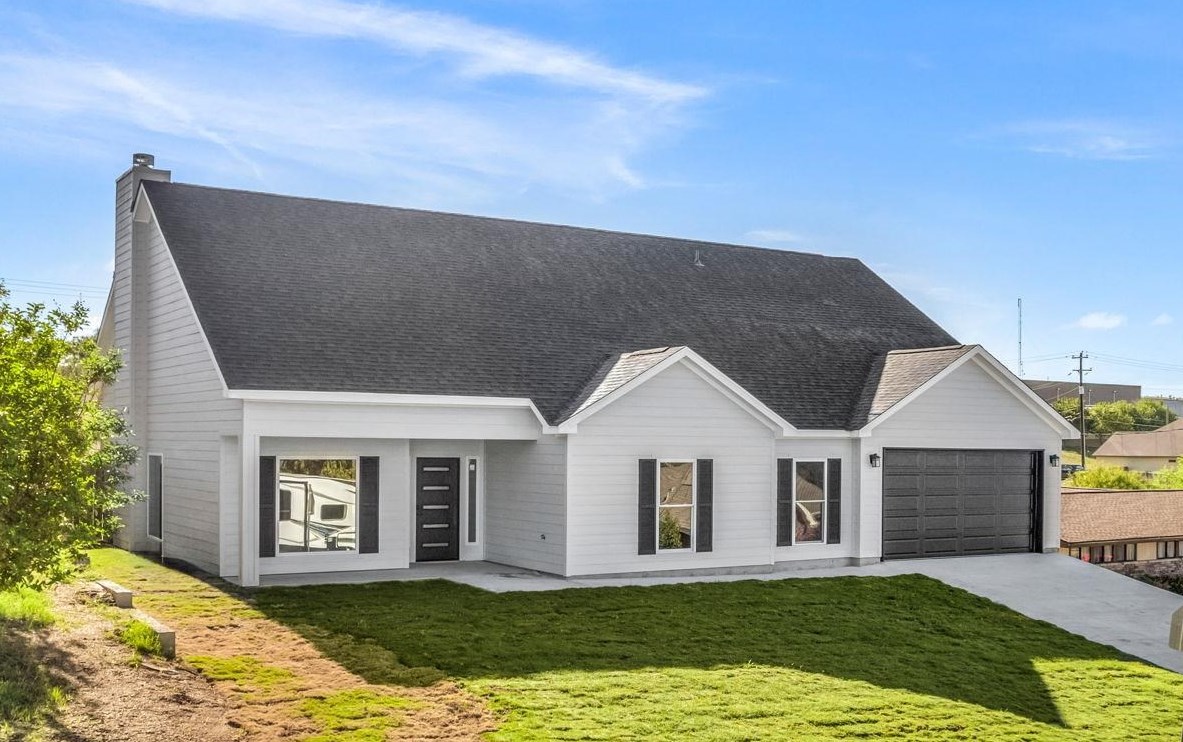 a front view of a house with a yard