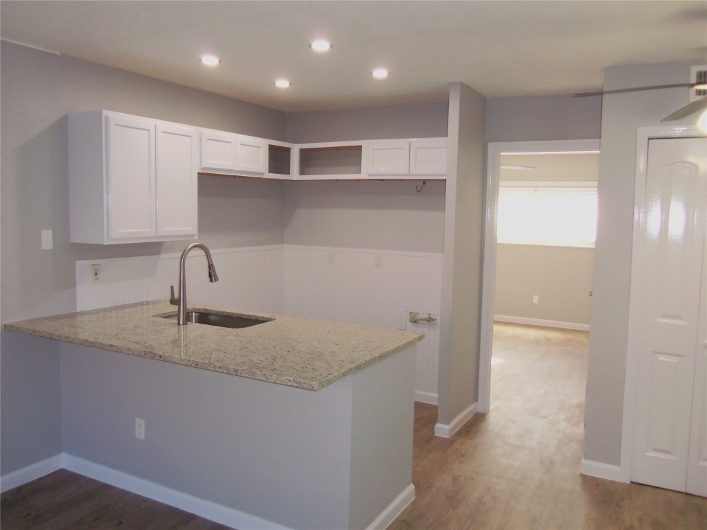 a kitchen with a sink and cabinets