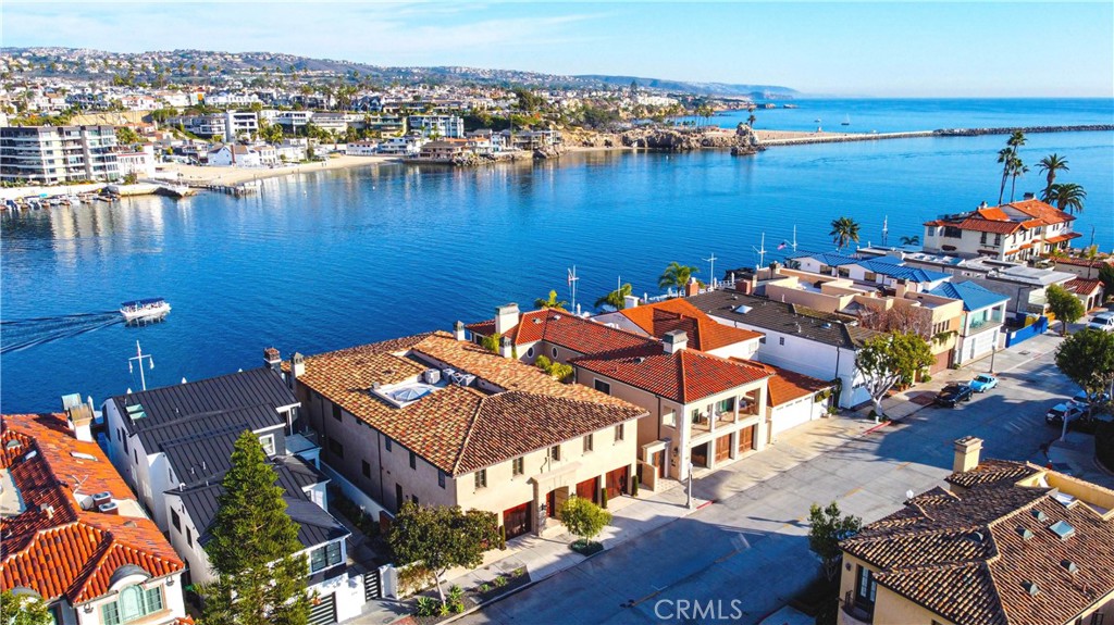 an aerial view of a house with a lake view