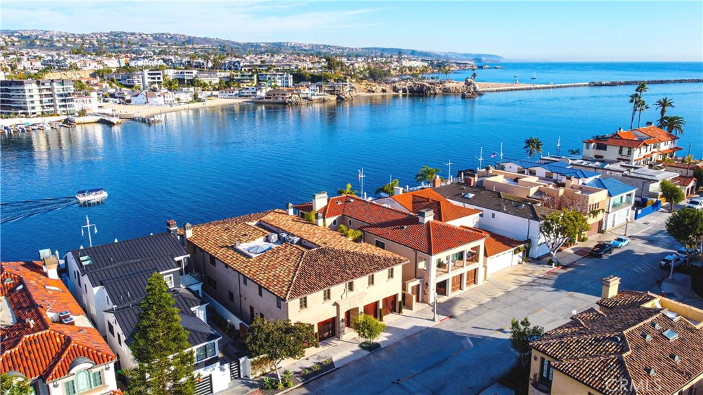 an aerial view of a house with a lake view