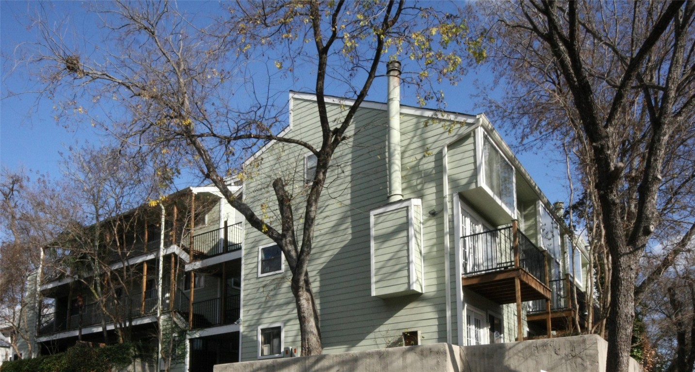 a view of a house with a tree