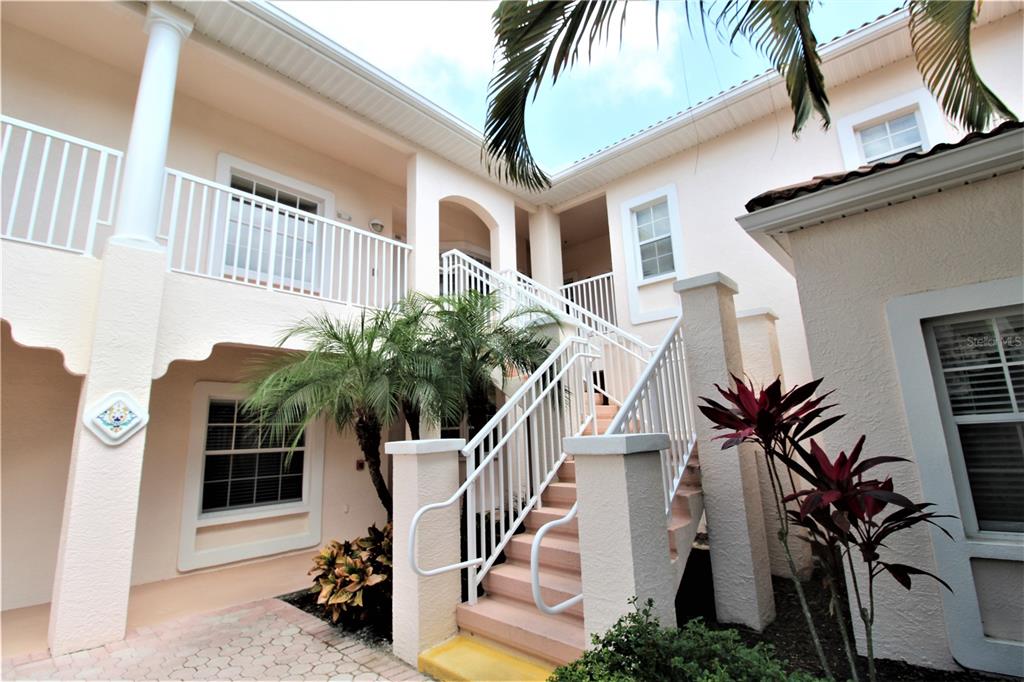 a view of balcony with furniture