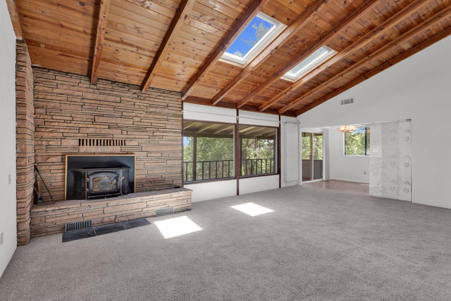 a view of an empty room with a fireplace