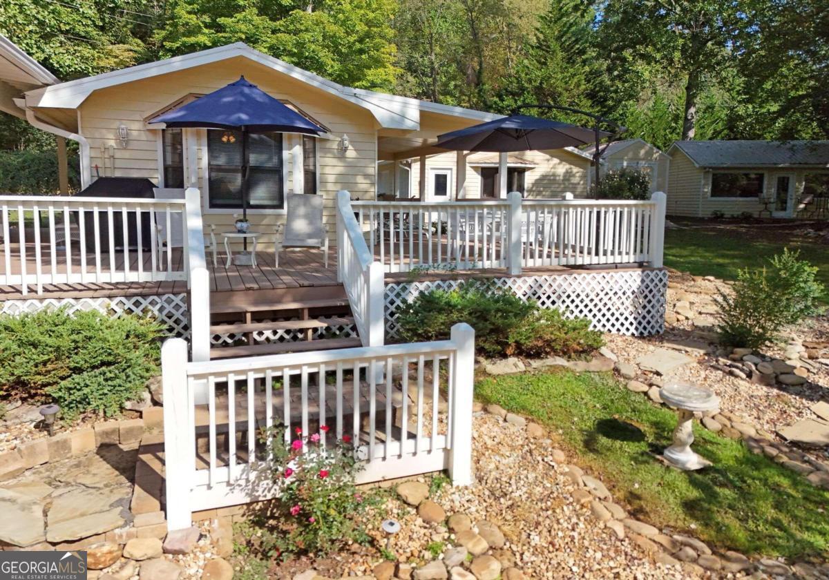 a view of a house with wooden fence