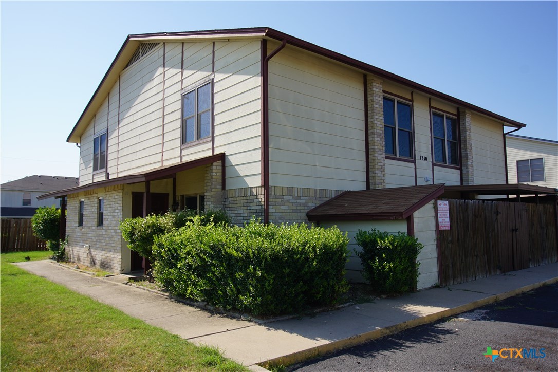 a front view of house with a yard