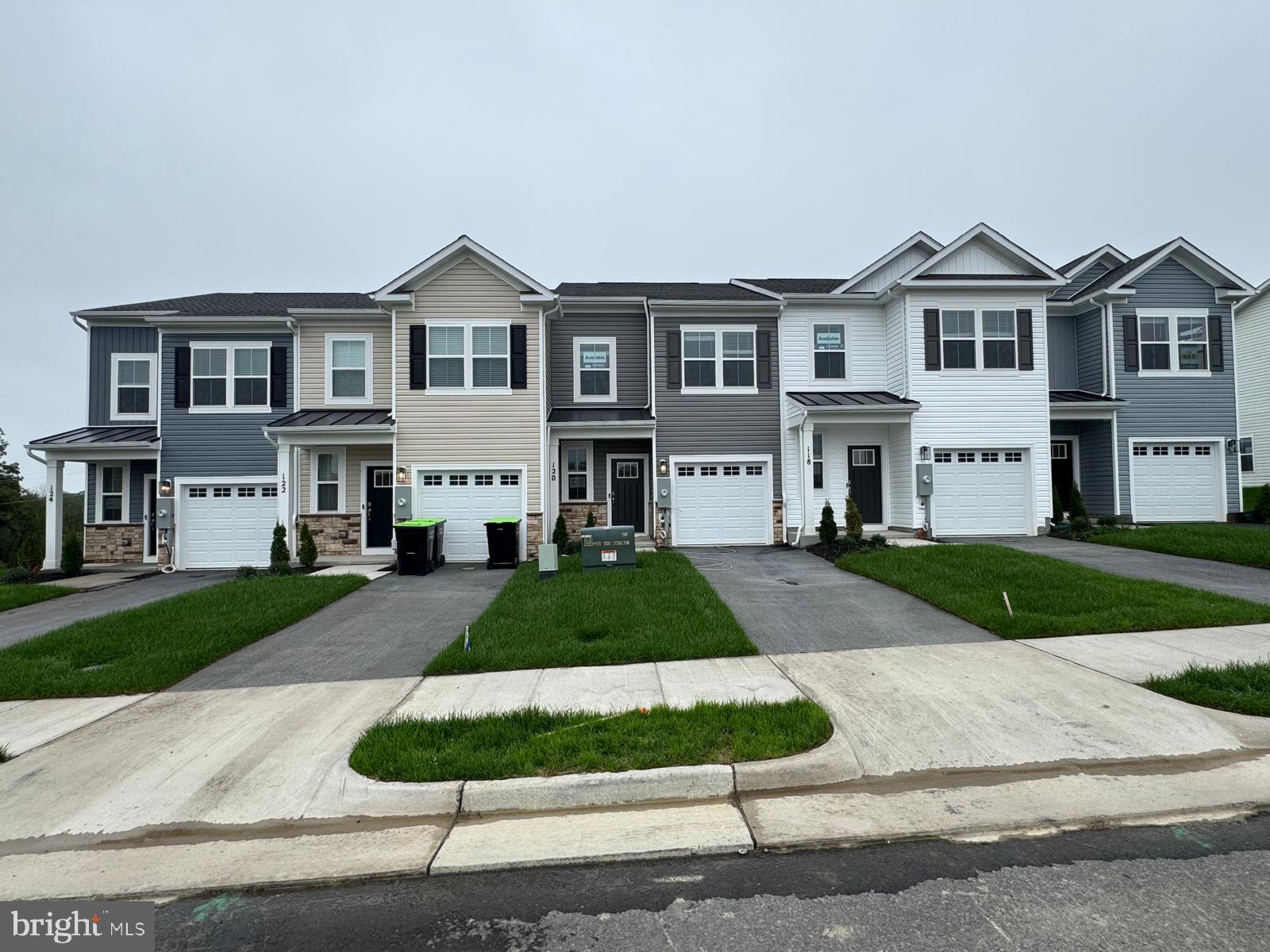 a view of house with yard and green space