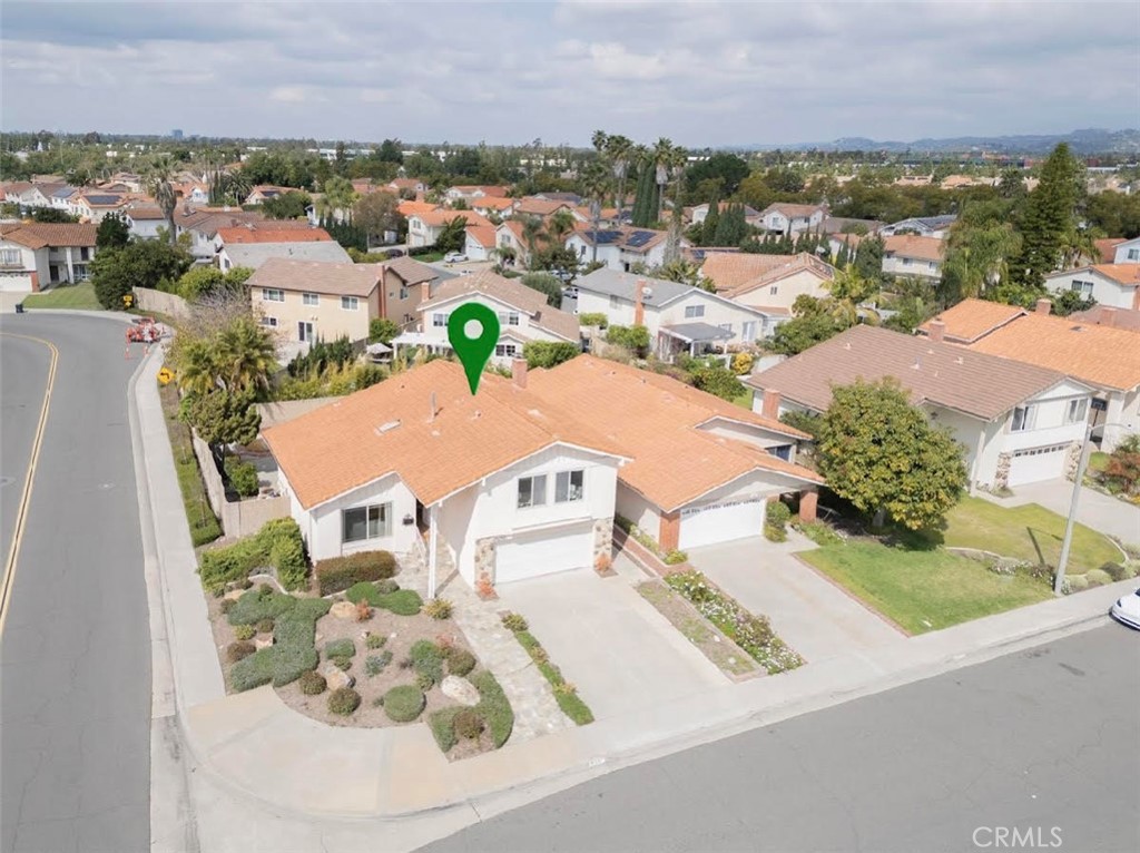 an aerial view of a residential houses with outdoor space