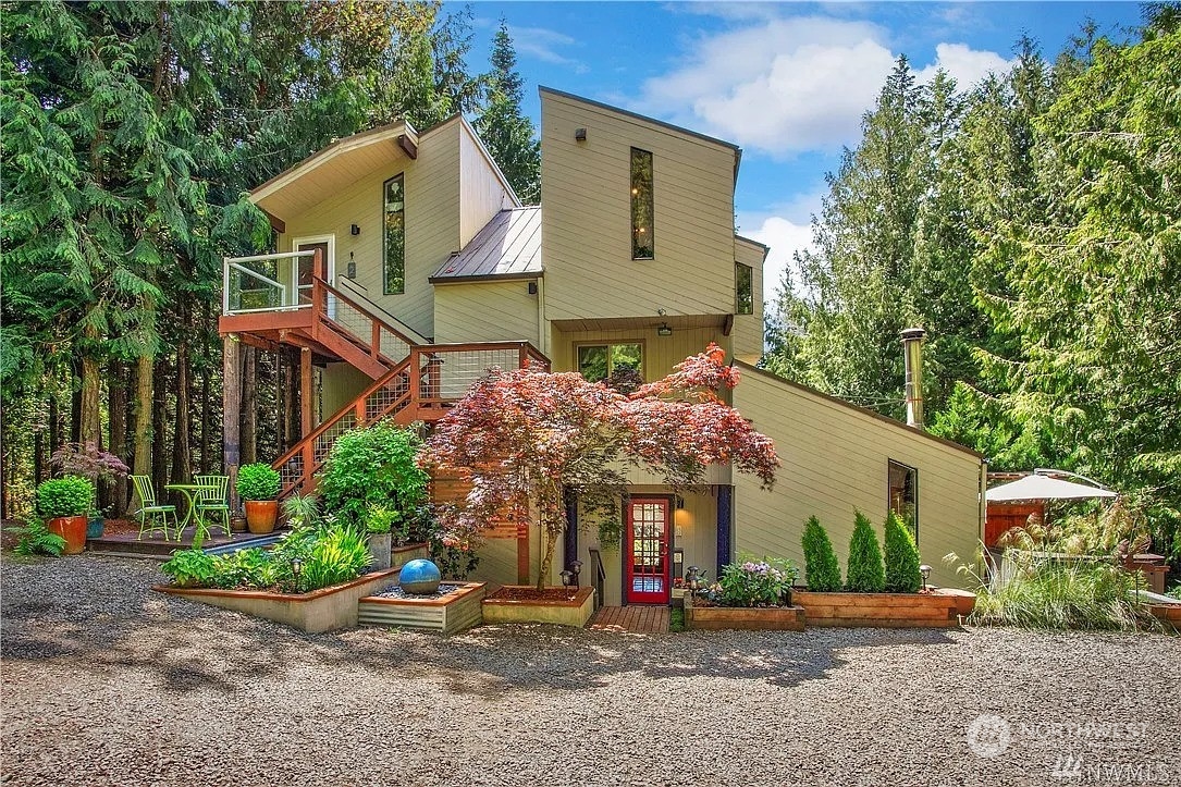 front view of house with potted plants