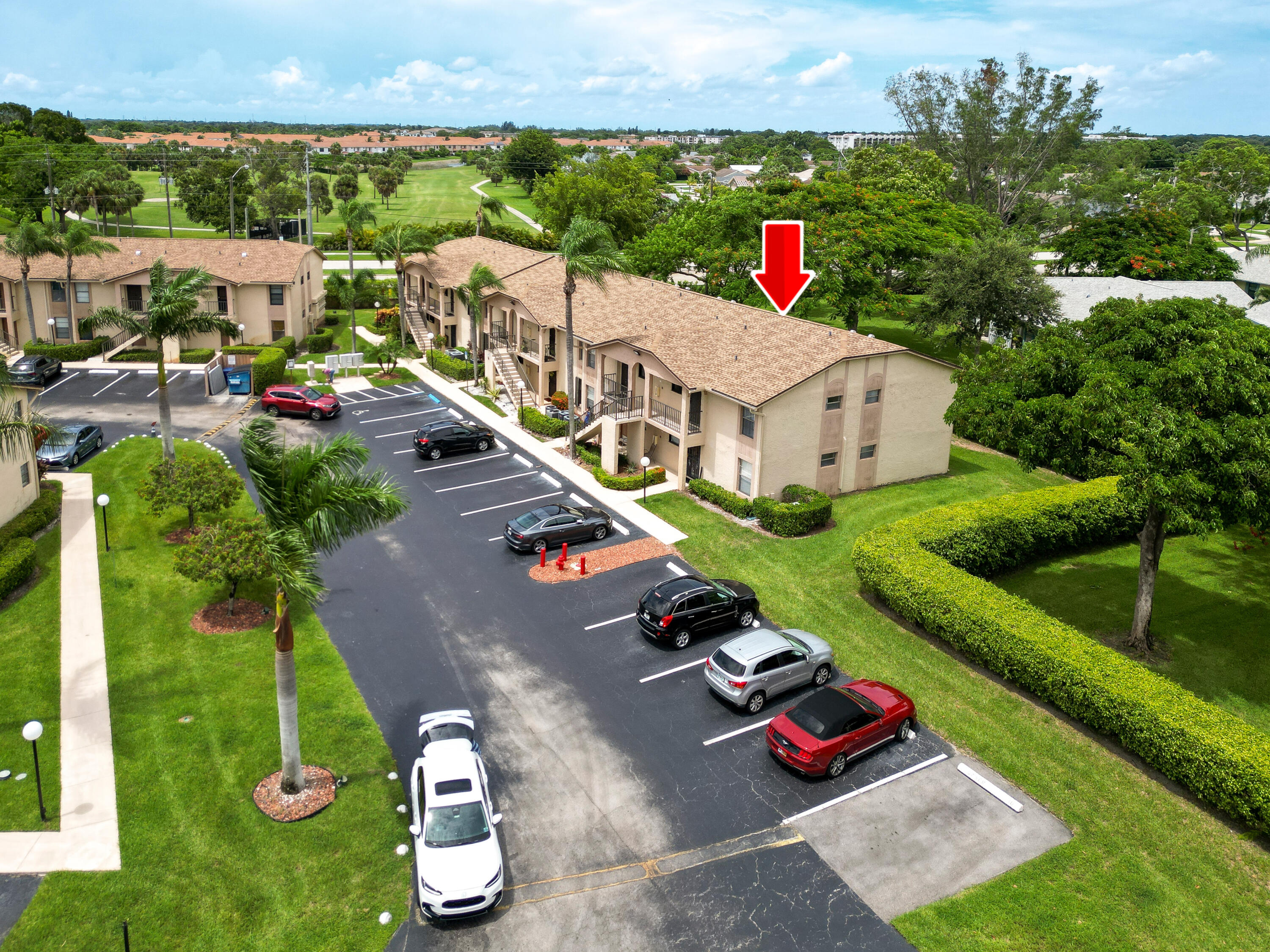 a aerial view of a house with swimming pool garden and patio