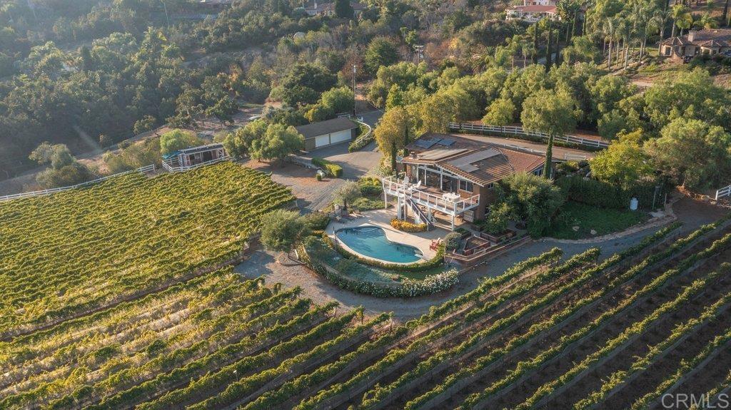 a aerial view of a house with garden space and street view