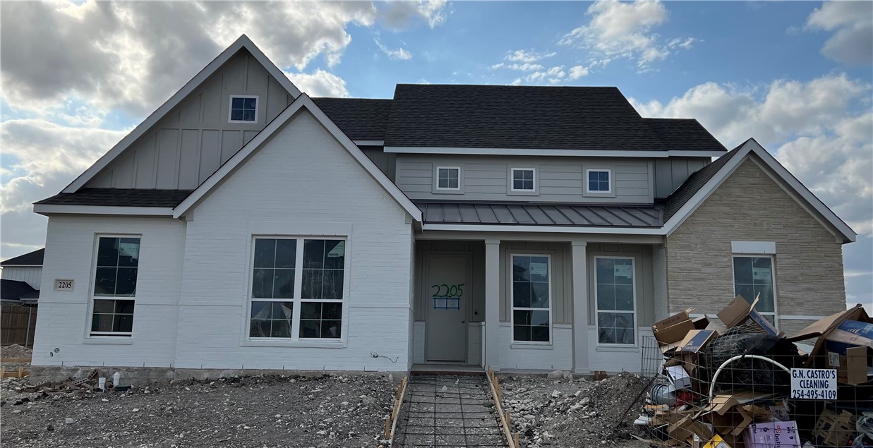 a front view of a house with many windows