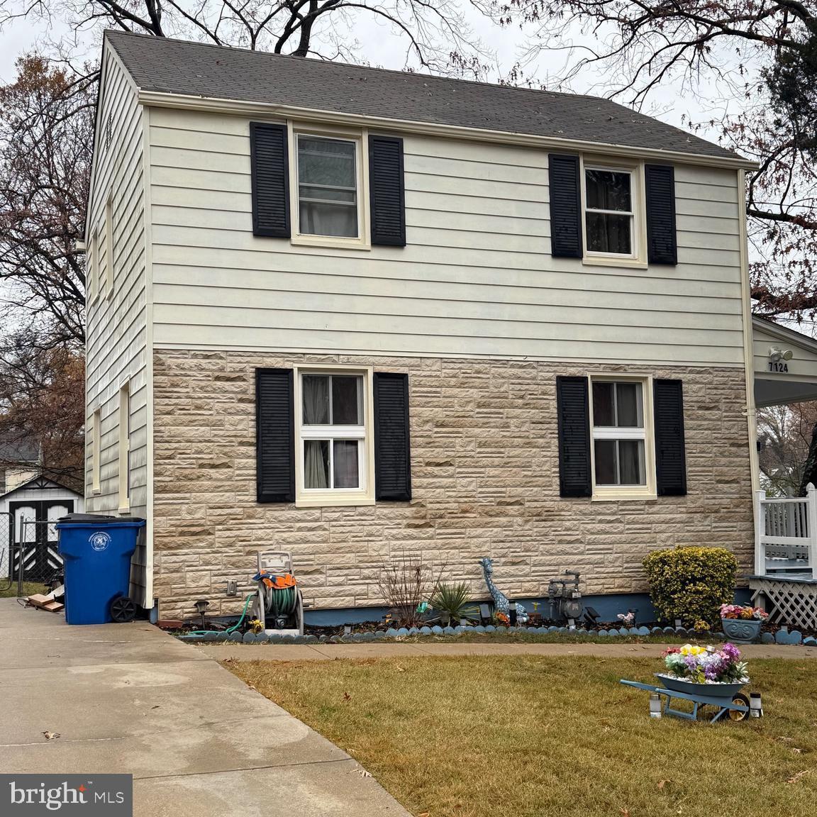 a front view of a house with a yard and a garage