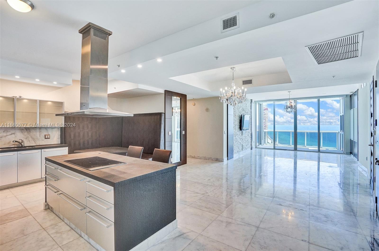 a kitchen with a sink a counter top space and appliances