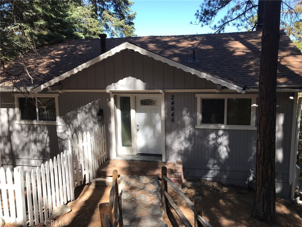 a front view of a house with yard